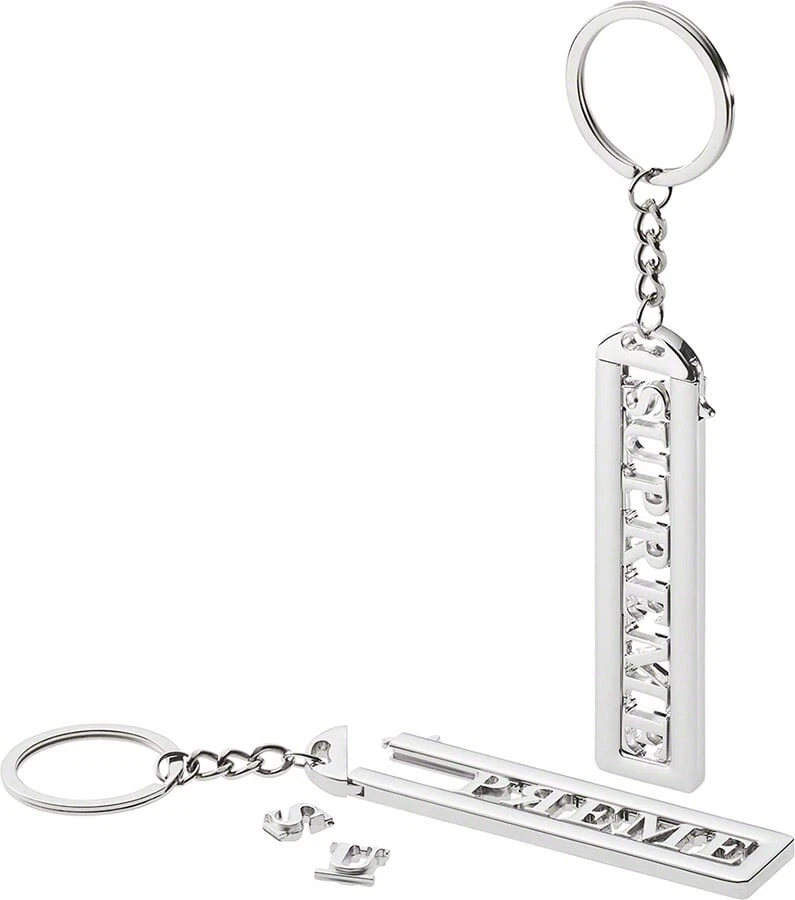Porte clés Supreme Slide • Chrome • FW22A79 • Cross Posted • Ferme $ • Épuisé
