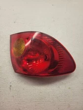 Toyota Corolla Driver Tail Light Quarter Panel Mounted Thru 2003 2004 OEM