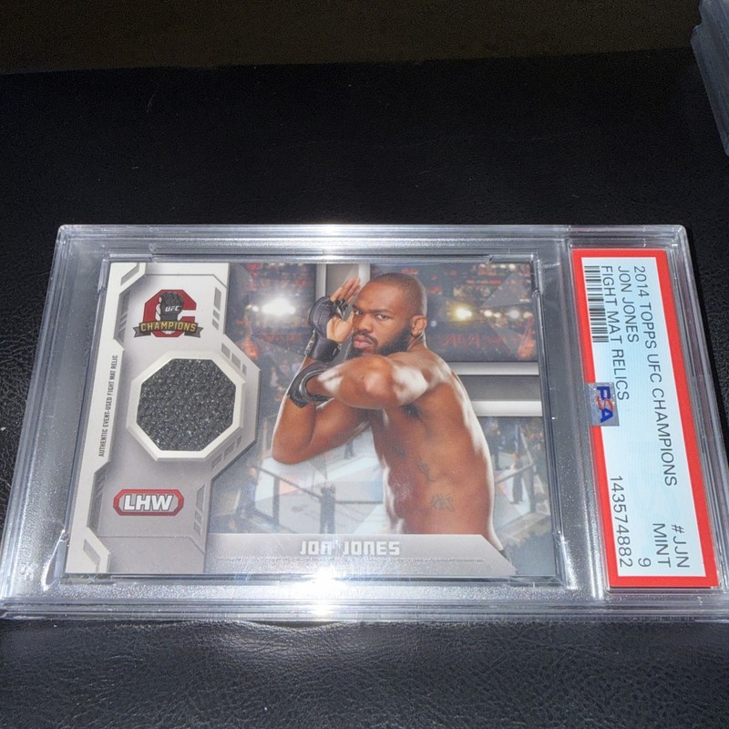 2014 Topps UFC Champions - Fighter Mat Relics Jon Jones #FMR-JJN (MEM)
