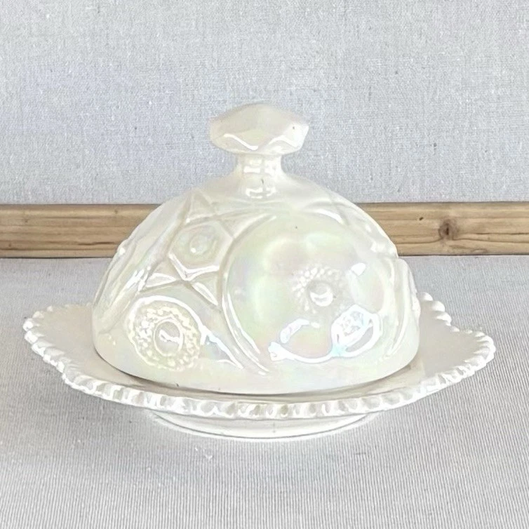Vintage iridescent ceramic dome butter dish in a floral pattern