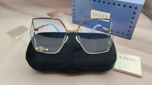 Stylish Gucci GG0817s Blue Square Sunglasses with Gold Metal Frame Stars Motif