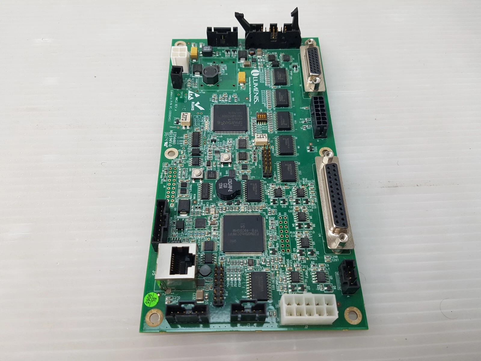 Lumenis PC-10000451 MMCU circuit board photographed lengthwise from above
