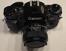 Canon A-1 35mm SLR Film Camera With 50 mm Lens Kit And User Manual