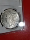 1880 S .90% Silver Morgan Dollar In Protective Case Beautiful Bright White Coin.