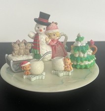 This is a 1999 Enesco Precious Moments Winter Mini Tea Set