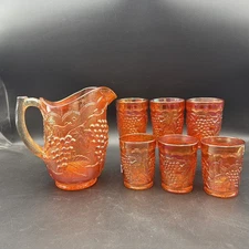Marigold Carnival Glass Grape Vine Pitcher and Tumblers
