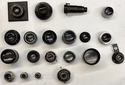 Vintage darkroom enlarging lenses and related optical components. Lot of 21