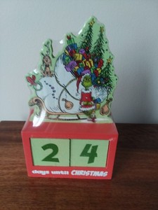 the Grinch countdown to Christmas brand new still sealed made of wood figure