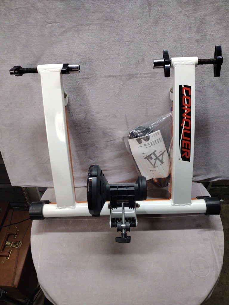 Turn bike to be stationary with Conquer Indoor Bike Trainer, portable stand