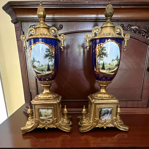 Pair Blue & Gold Lidded Urn Vases, Scenic Landscape Panels, Metal Base