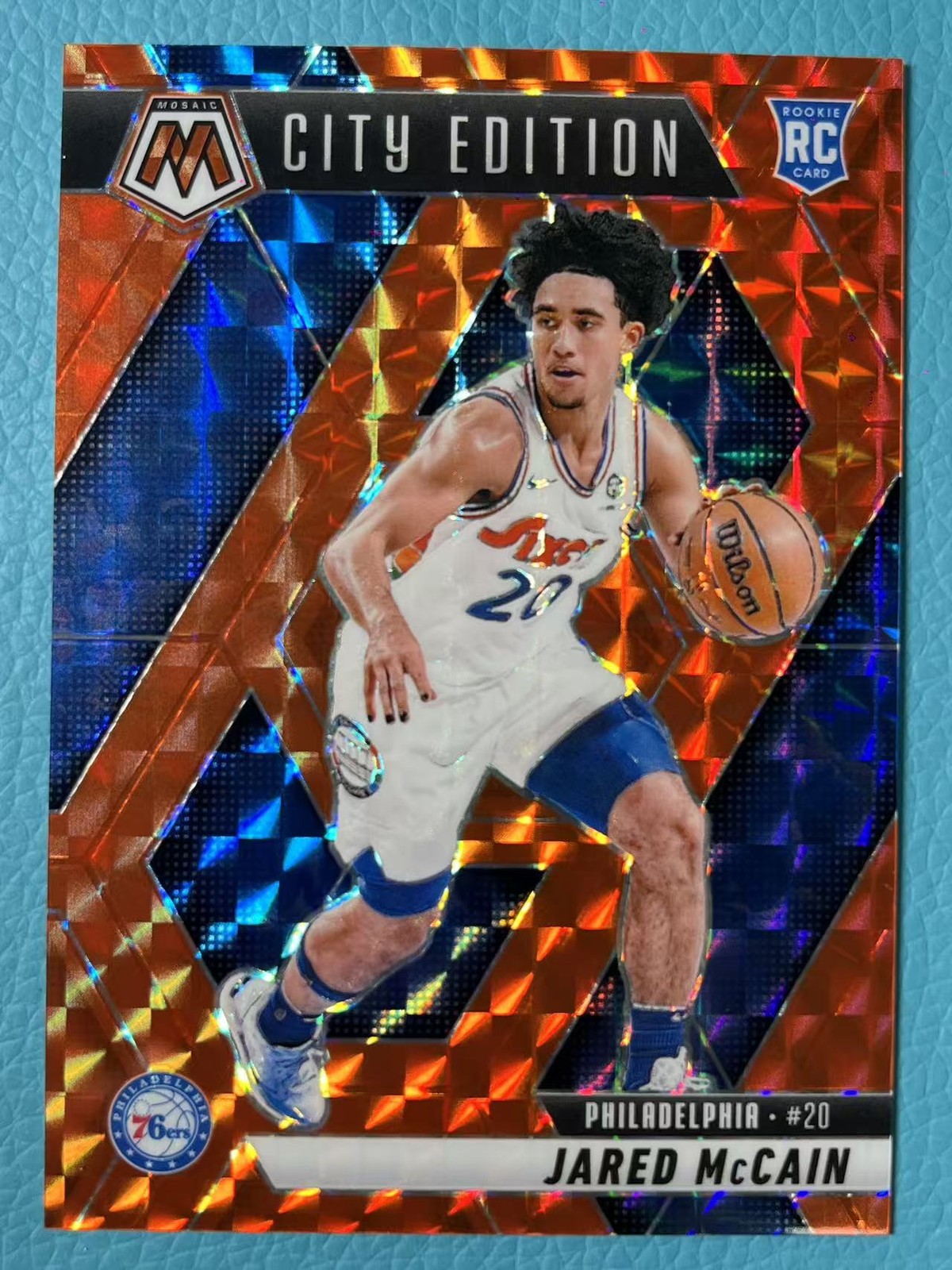 Jared McCain 2024-25 Panini Mosaic 055/249 Orange City Edition RC #277