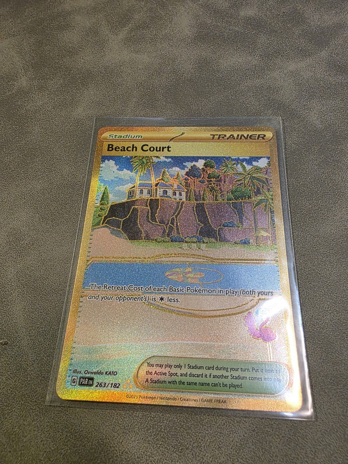 Beach Court Trainer 263/182 Gold Secret Rare Pokémon 2023 Paradox Rift NM