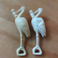 Set of Two Antique Celluloid Baby Rattle Crib Toy Stork with Baby Vintage Cream