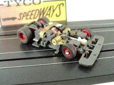Tyco TCR Chassis with Red Wheels from 1991. Runs Nice New Pickup Shoes