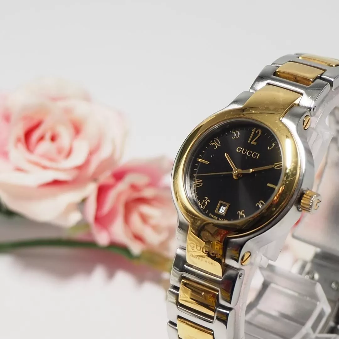 Montre GUCCI dorée et noire neuve pile fonctionne D527