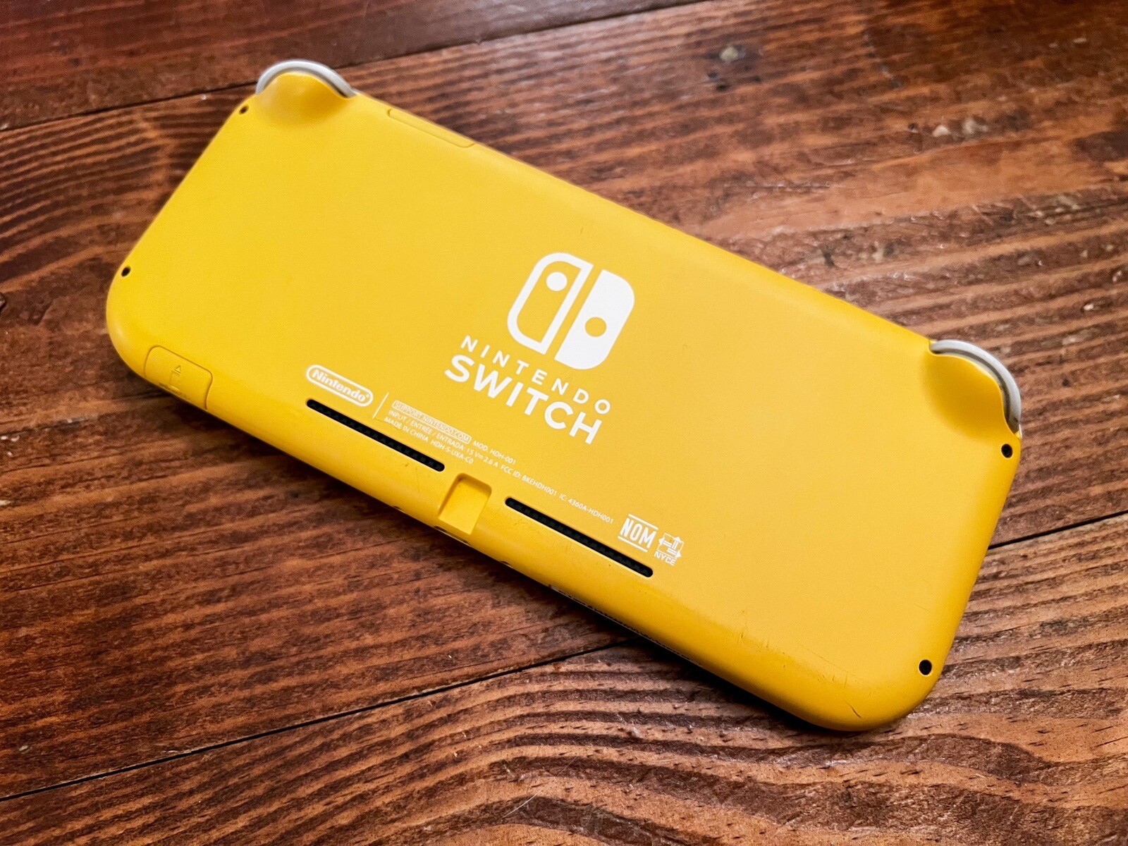 Nintendo Switch Lite Console (Yellow HDH001) with Charger + 64GB