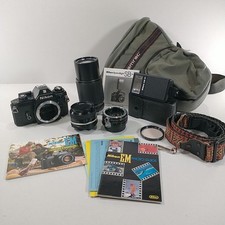 Nikon EM 35mm SLR Film Camera  Manual 2 Lenses Flash Teleconverter Strap  Case