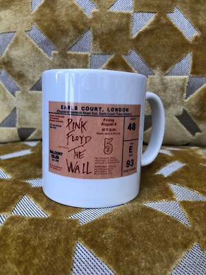 PINK FLOYD- A Ceramic 11oz Mug . Featuring a 1980   The Wall ticket on each side