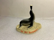 GUINNESS GUILROY SEAL BALANCING A BEER. LOVELY DAY FOR A GUINNESS!