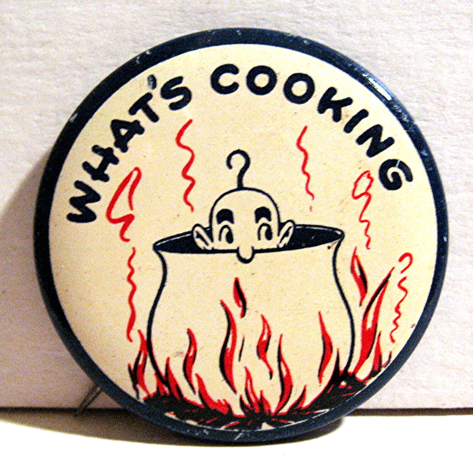 1940s–50s old store stock novelty pinback button with a 'What's Cooking' gag — 80-year-old deadstock humor you can pin to a jacket today.