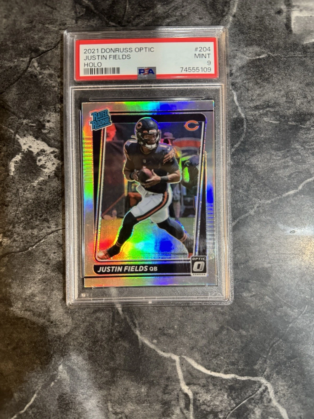 Deal for JUSTIN FIELDS 2021 DONRUSS OPTIC RATED ROOKIE FOOTBALL HOLO RC PSA 9