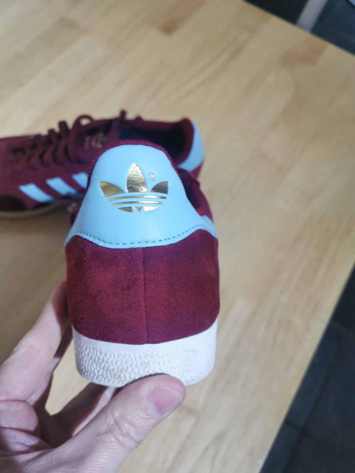 claret and blue adidas trainers