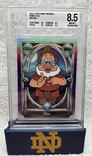2025 Topps, Disney Wonder Purple Foil # 101 Doc / 99 BGS 8.5
