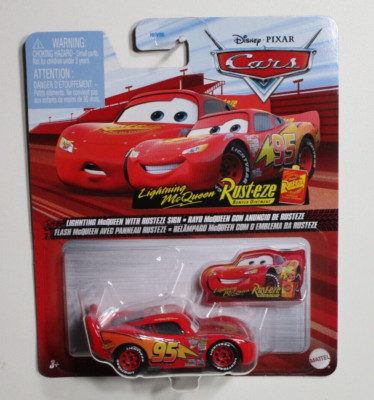 DISNEY PIXAR CARS  LIGHTNING MCQUEEN WITH RUSTEZE SIGN RACE TRACK SCENE DXV29