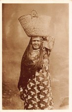 B557 Ethnic Native Egyptian Girl caring Basket RPPC vintage postcard