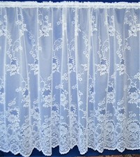 CLUMBER DELICATE ALL OVER FLOWER DESIGN WITH SCALLOPED EDGE BY THE METRE.