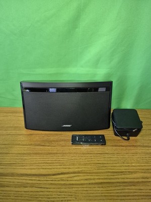 Bose SoundLink Air digital music system with power supply and remote control .