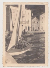 Shirtless Men and Young Women in Swimwear Embrace Happiness on the Beach Photo