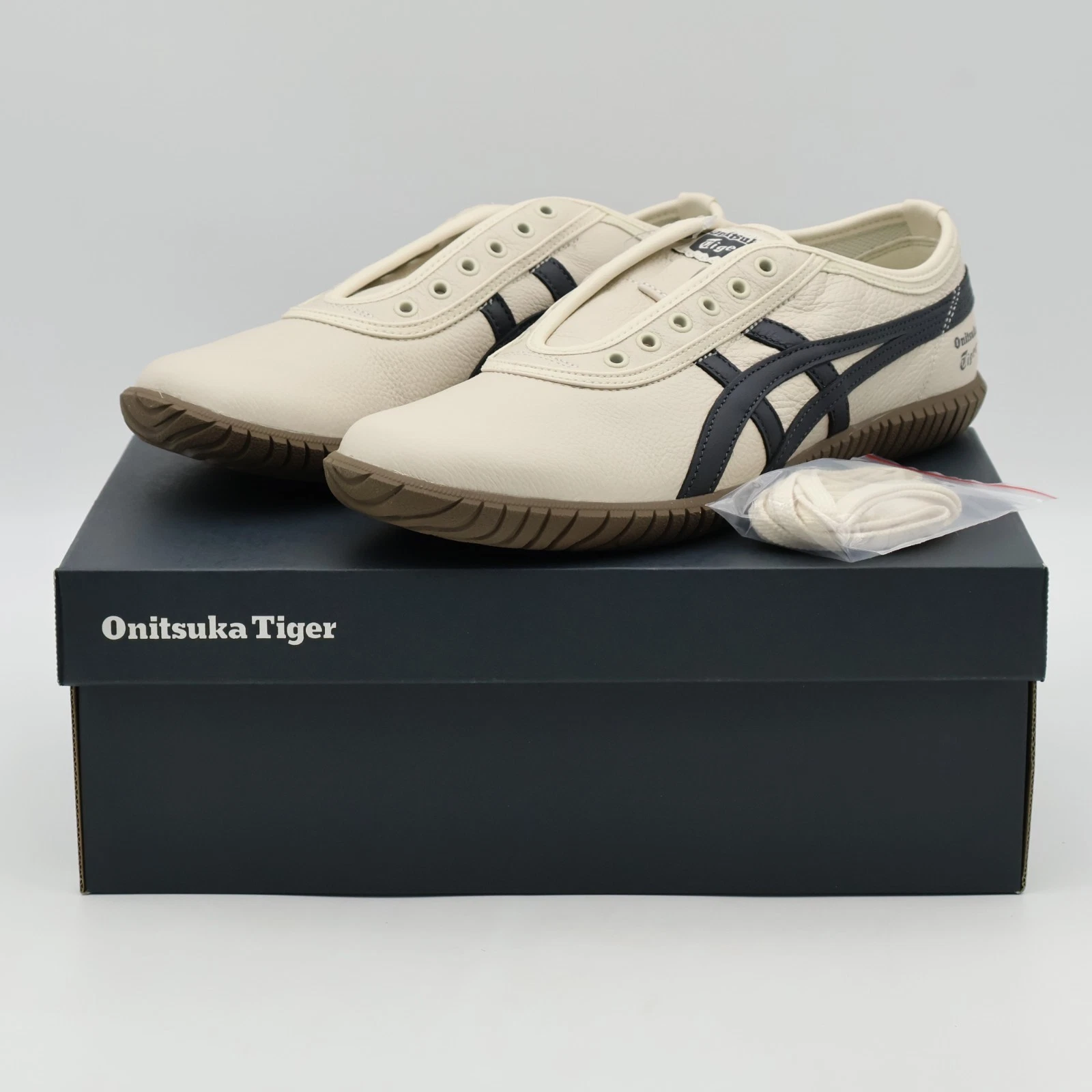 1183C529-200 Onitsuka Tiger Tsunahiki Slip On Birch Indigo Navy (Men's)
Opens in a new window or tab