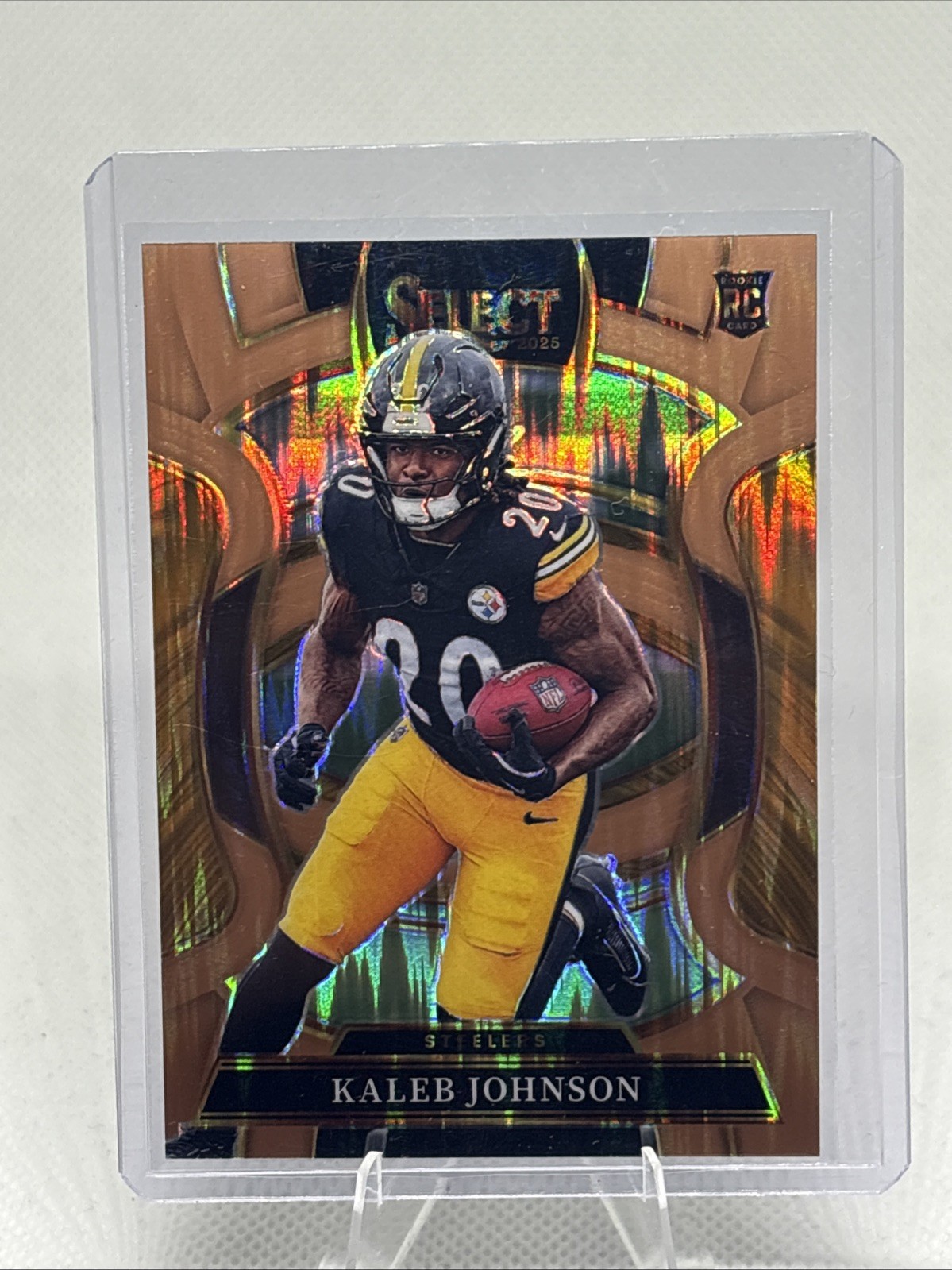 2025 Panini Select -  Kaleb Johnson #52 Copper Prizm Shock /899 (RC). Steelers