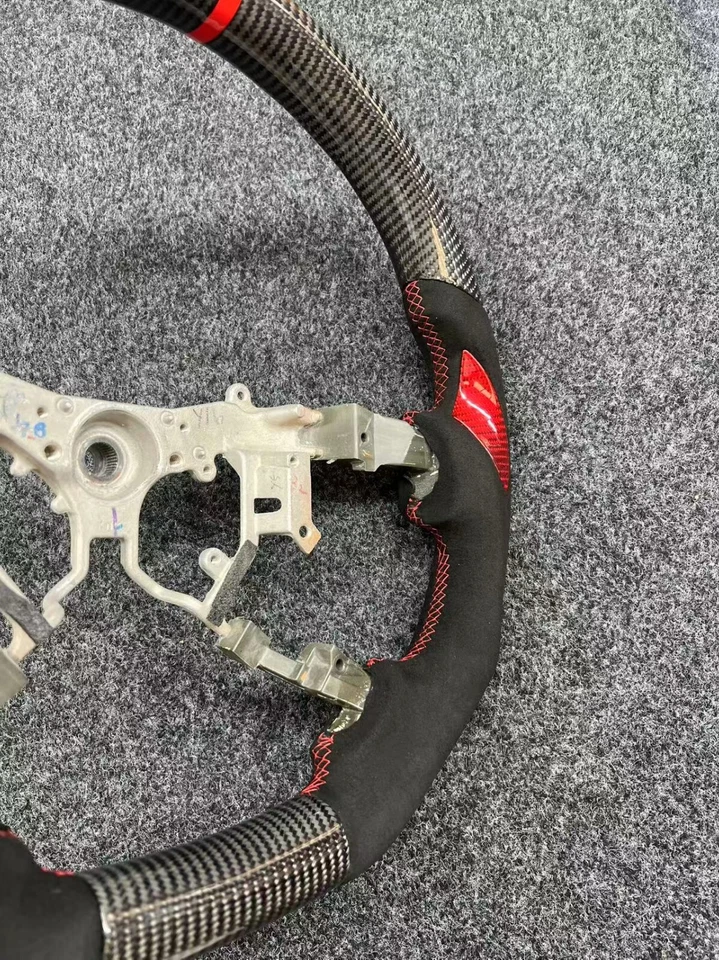 Volante de cuero de fibra de carbono apto para Toyota Tundra Land Cruiser Sequoia HiAce Foto 2 de 4