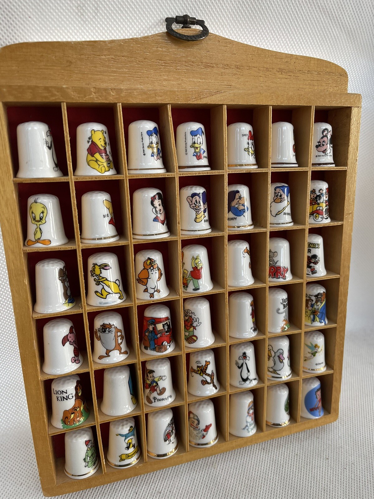 Thimble display case with 42 thimbles cartoon characters eBay