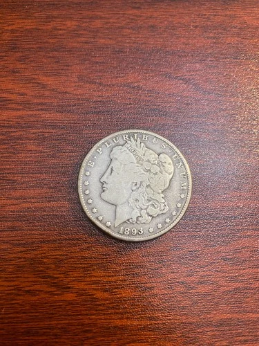 1893-O Morgan $1 – VG Cond – Rim Bump Scratched Tough Date