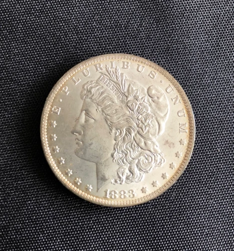1883-O Morgan Dollar. Uncirculated Luster, Light Rim Toning. Ungraded.