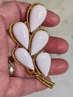 Vintage signed Crown TRIFARI gold and white milk glass brooch