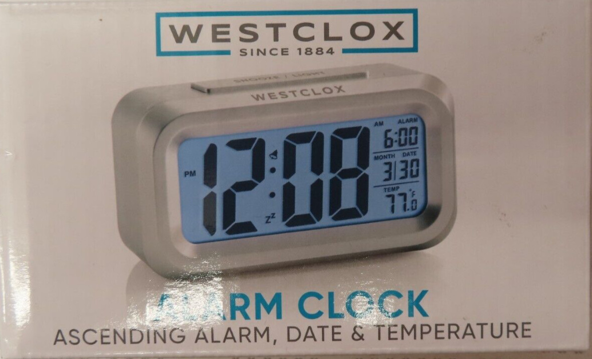 NEW  Westclox Blue LCD Alarm Clock 70045A Battery Powered Silver Digital