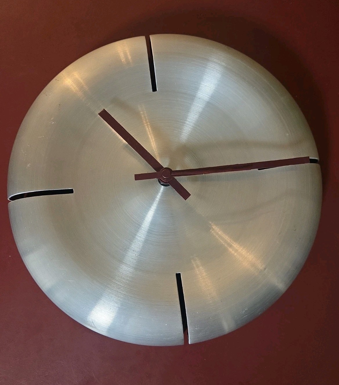 Umbra "Gyro" wall clock designed by Karim Rashid Working