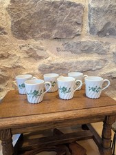 Limoges Haviland. 6 tasses à café  en porcelaine motif floral torsadé