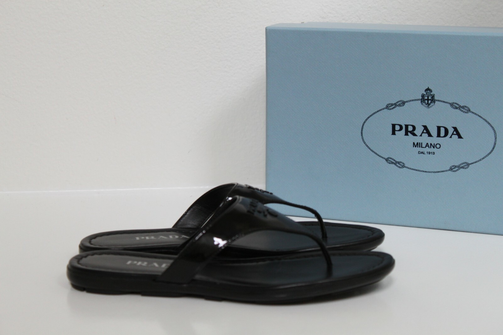 prada logo flip flop