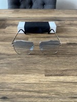 Stylish silver aviator-style sunglasses  With Blue-tinted lenses.