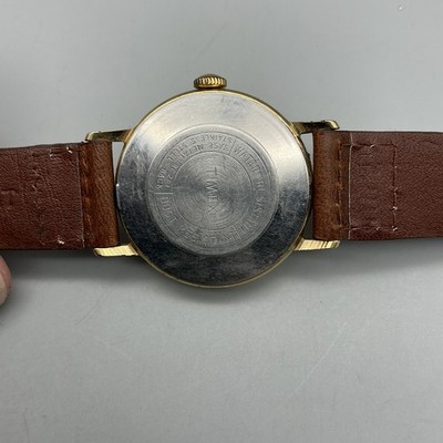 Vintage Timex Sprite Mens Watch 30mm Gold Tone Leather Date  display picture 3