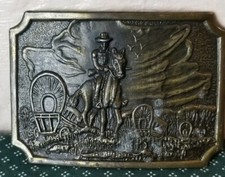 Cowboy On Horse with Arms and Wagons Mens Belt Buckle