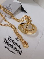 Vivienne Westwood- Grand collier 3D Orbe transparent plaqué or et des cristaux .