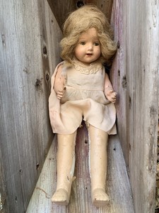 creepy baby teeth doll
