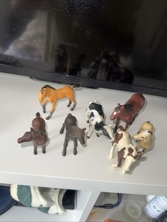 Toy Horses And A Cow