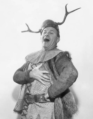 comedian George Burns 'sings' in a Viking opera costume in a promo- Old Photo